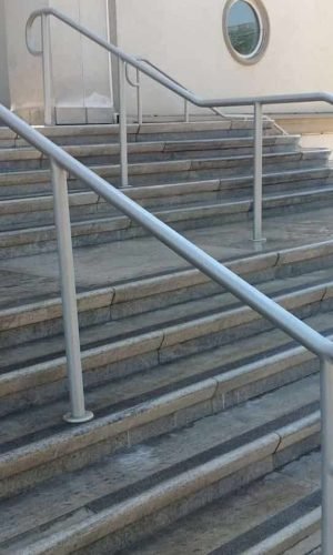 Pressure washing service cleaning outdoor stairs and handrails in California.