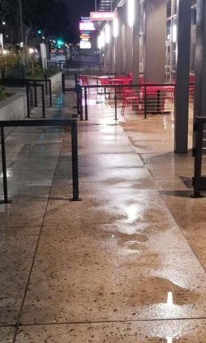 Commercial sidewalk cleaning in California with pressure washing services.
