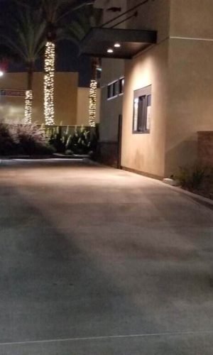 Professional pressure washing service cleaning driveway and exterior surfaces in California.
