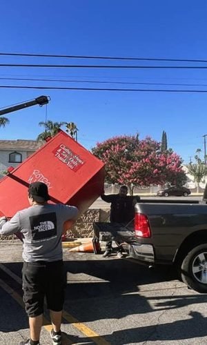Professional pressure washing equipment cleaning a vehicle in California.