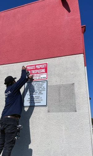 Professional pressure washing of building exterior for property maintenance and cleaning.