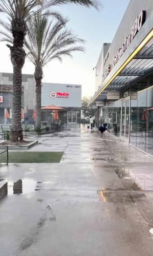 Pressure washing storefronts and sidewalks in California for a clean, professional appearance.